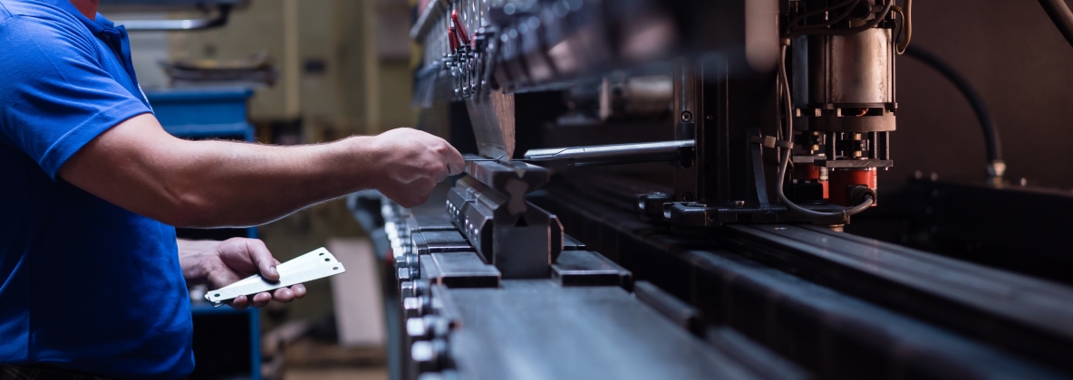 Worker holding a metal plate